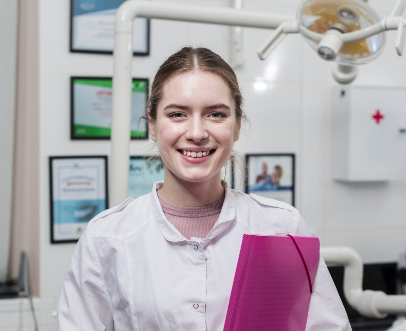 portrait-smiley-dentist-clinic-scaled-e1770368741869-1